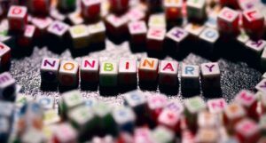 letter blocks in assorted colors that spell out "nonbinary" https://unsplash.com/photos/u3pRViUI2oU