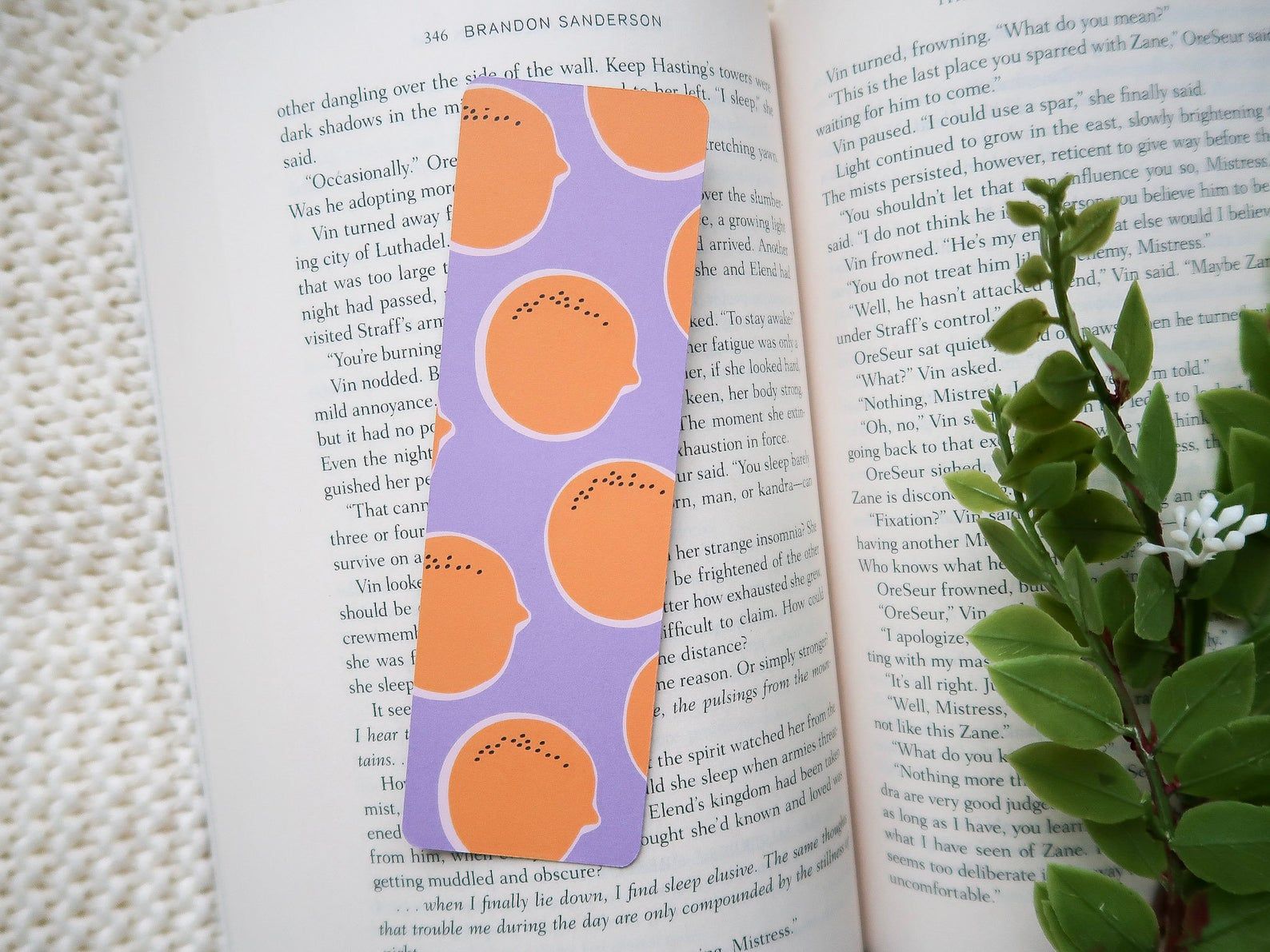 Image of purple bookmark with oranges on it. 