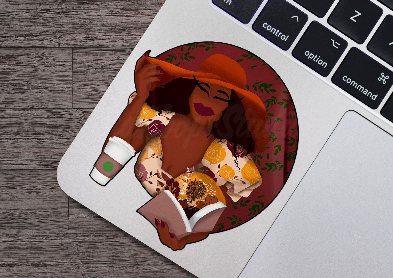 Image of a small sticker depicting a glamorous Black woman in a read hat and yellow floral dress, with a cup of coffee. She's holding a book that is open, and glowing light and fall florals seem to be bursting form the book.