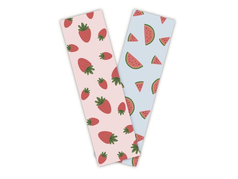 Pair of bookmarks: one pink with strawberries and one blue with watermelons. 