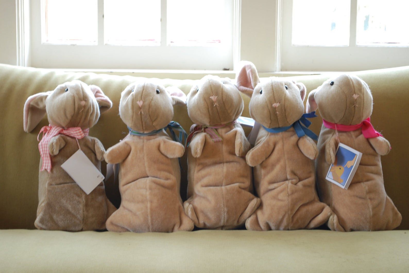 Image of five hand-made velveteen rabbits. 