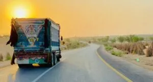 white and blue truck sunset