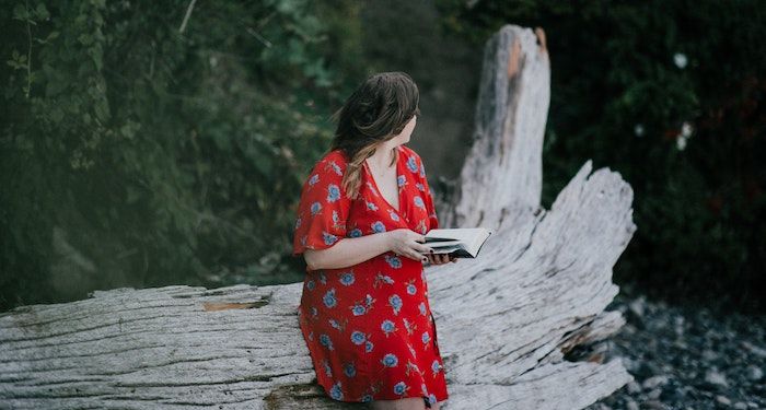 woman reading outdoors