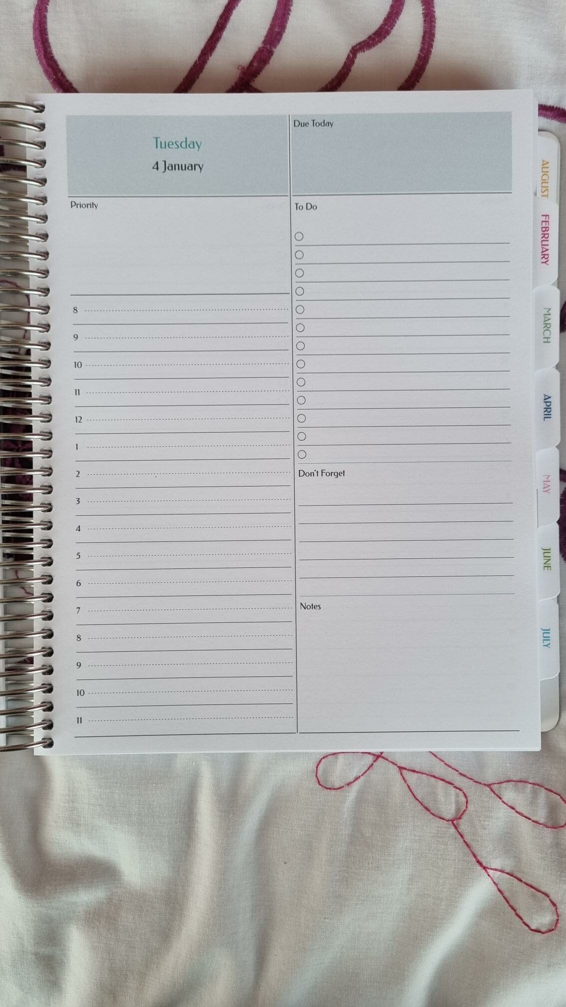 Agendio Layout, with Tuesday taking up one whole page. One column is labelled Priority with numbers. The other has To Do, Don't Forget, and Notes