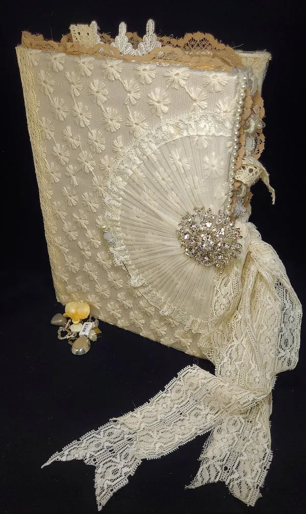 Wedding junk journal with lace and sparkly embellishment on cover. 