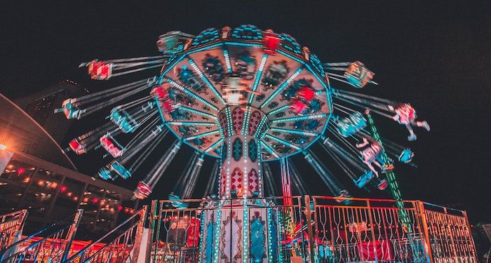 amusement park ride lit up at night