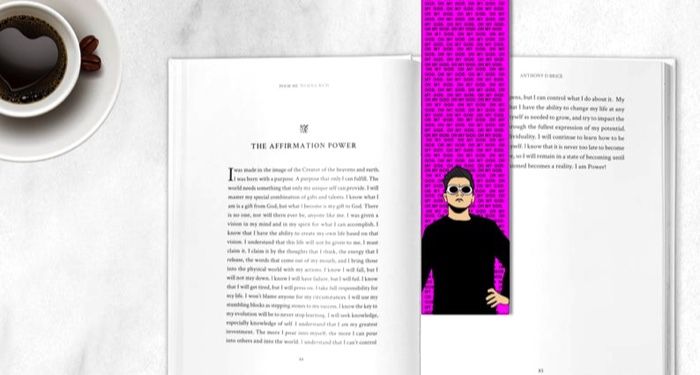 a hot pink David Rose bookmark inside of an open book