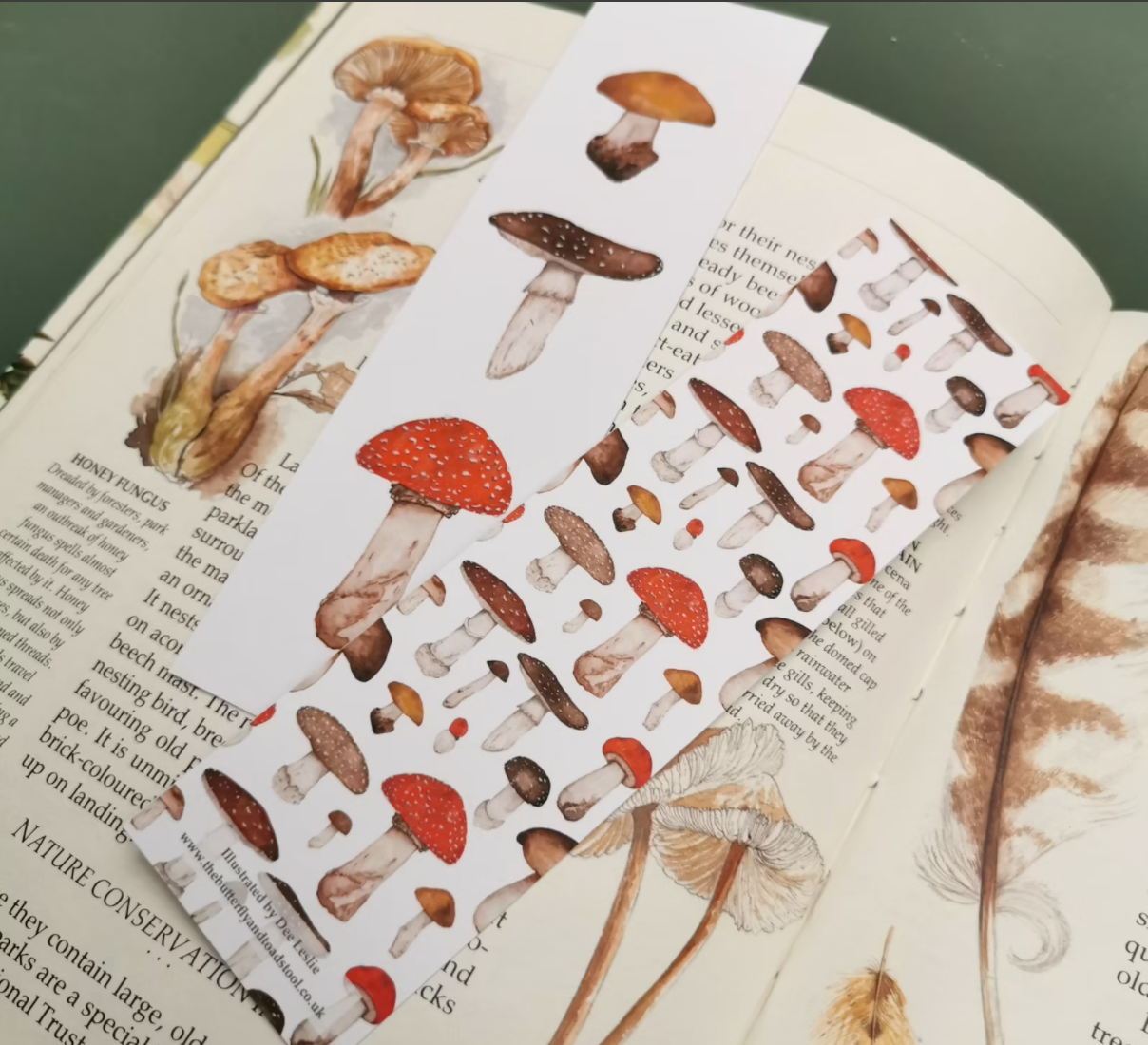 Double sided mushroom bookmark in earthy, neutral colos.