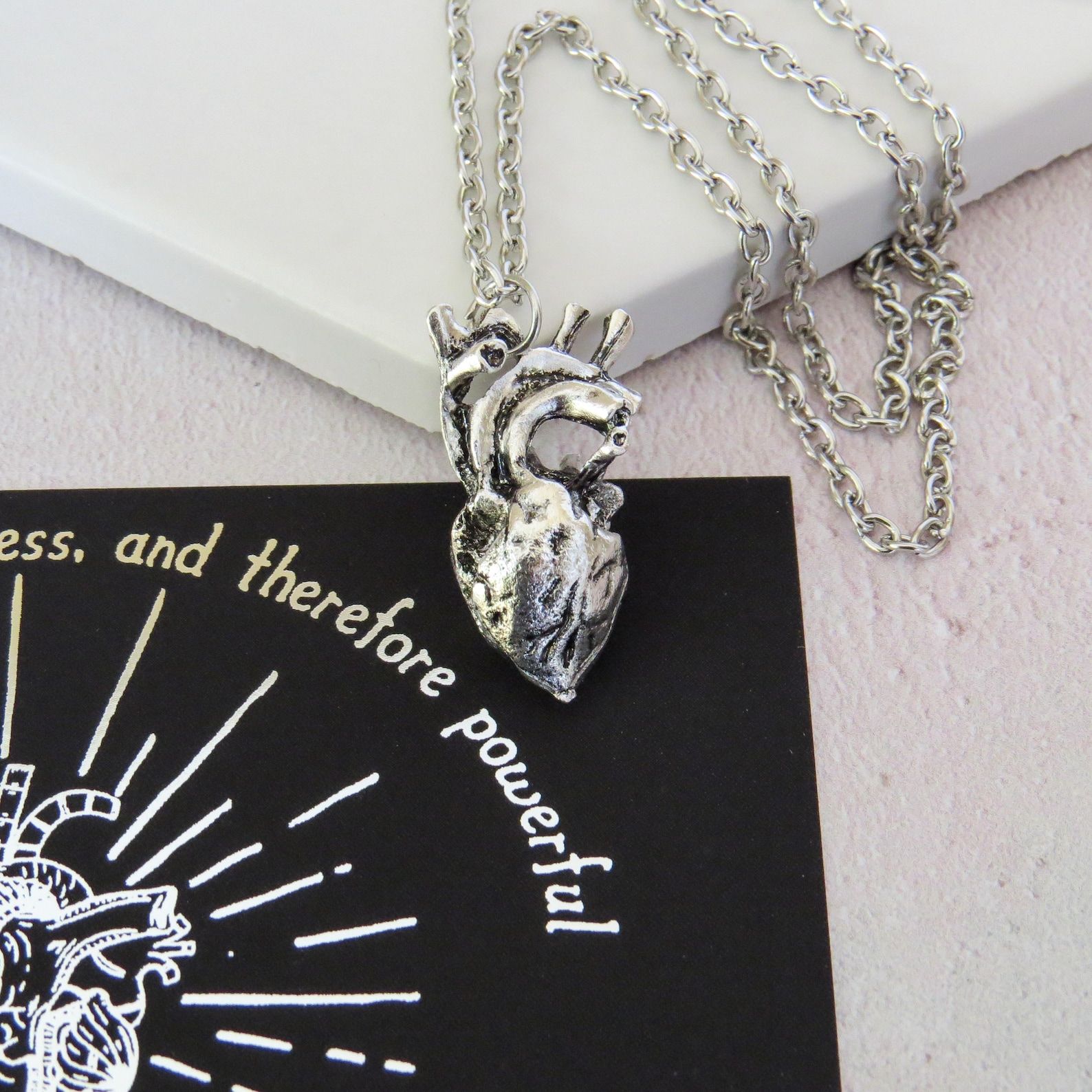 Silver anatomical heart charm on a silver chain