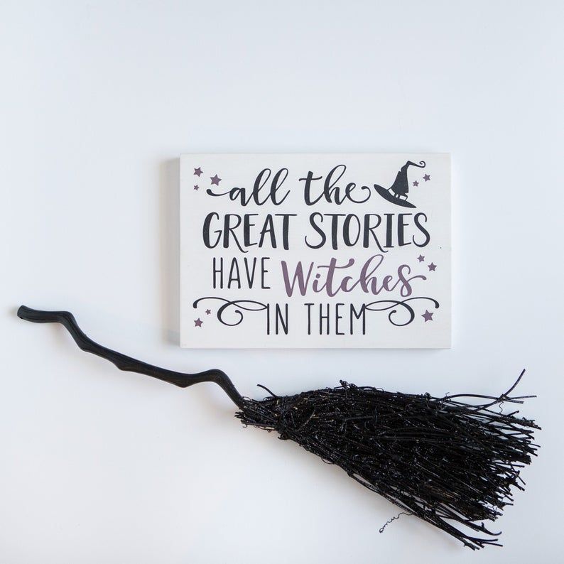 Image of white sign with black text reading "all the great stories have witches in them."