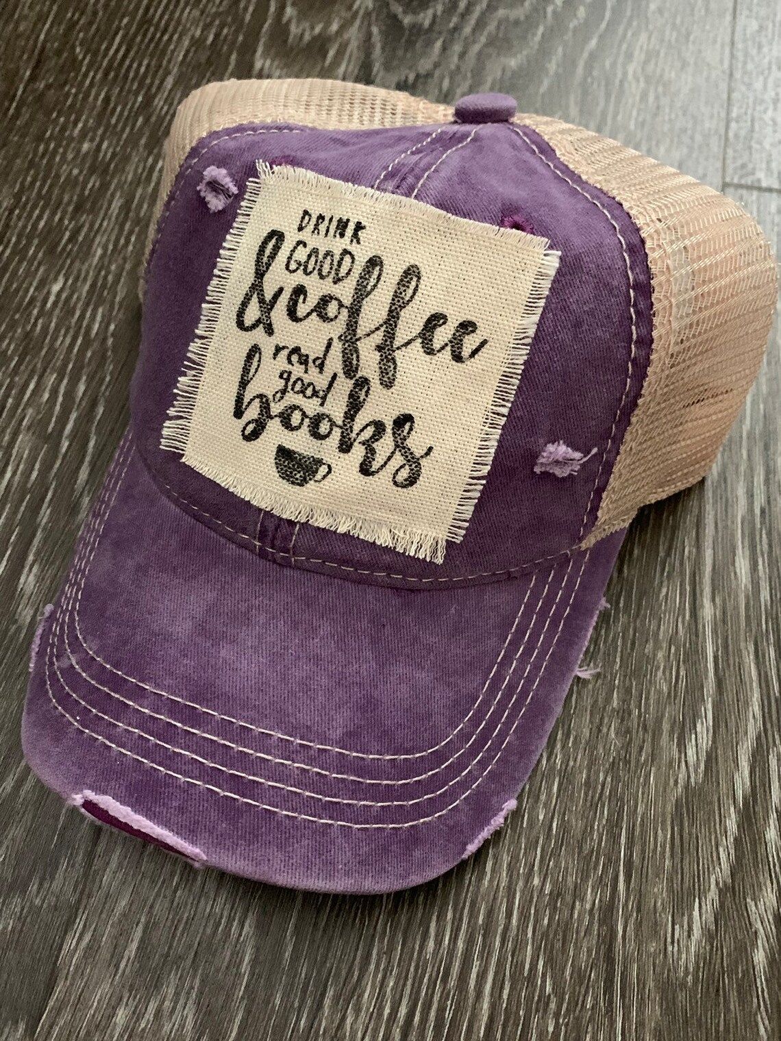 hat that says "drink good coffee & read good books" 