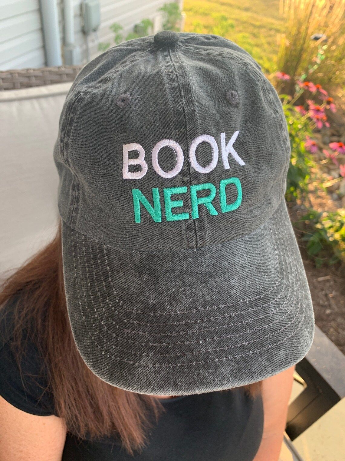  hat that says "Book Nerd"