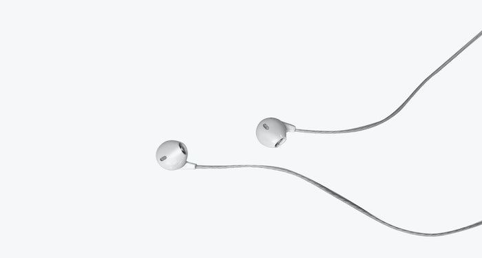 Image of white headphones on white background