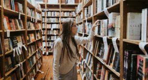 a photo of a woman browsing a bookstore