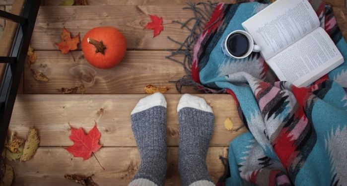 person wearing gray sock standing on stairs with autumn vibes