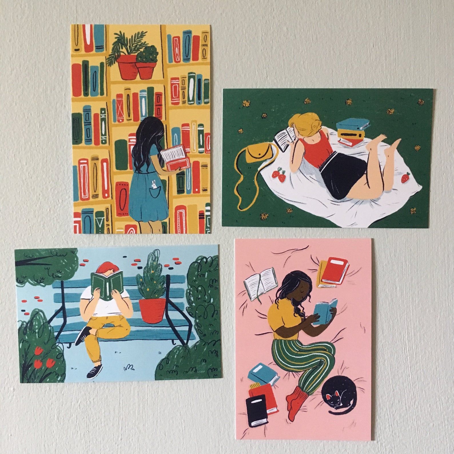 Four illustrated postcards depicting various people reading.