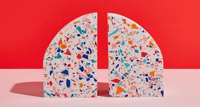White terrazzo bookends in the shape of an arch
