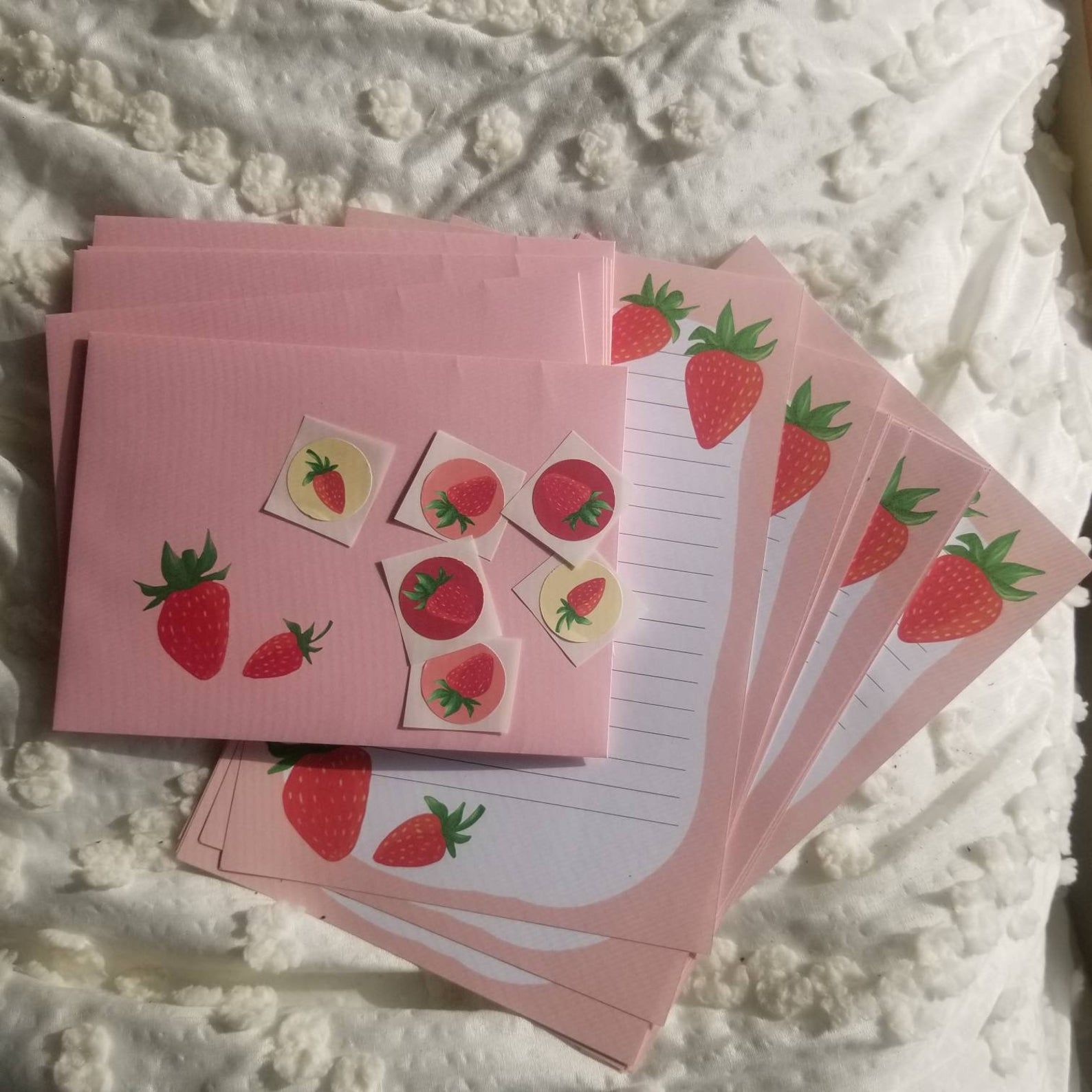 envelopes, stationary, and stickers in a strawberry print. 