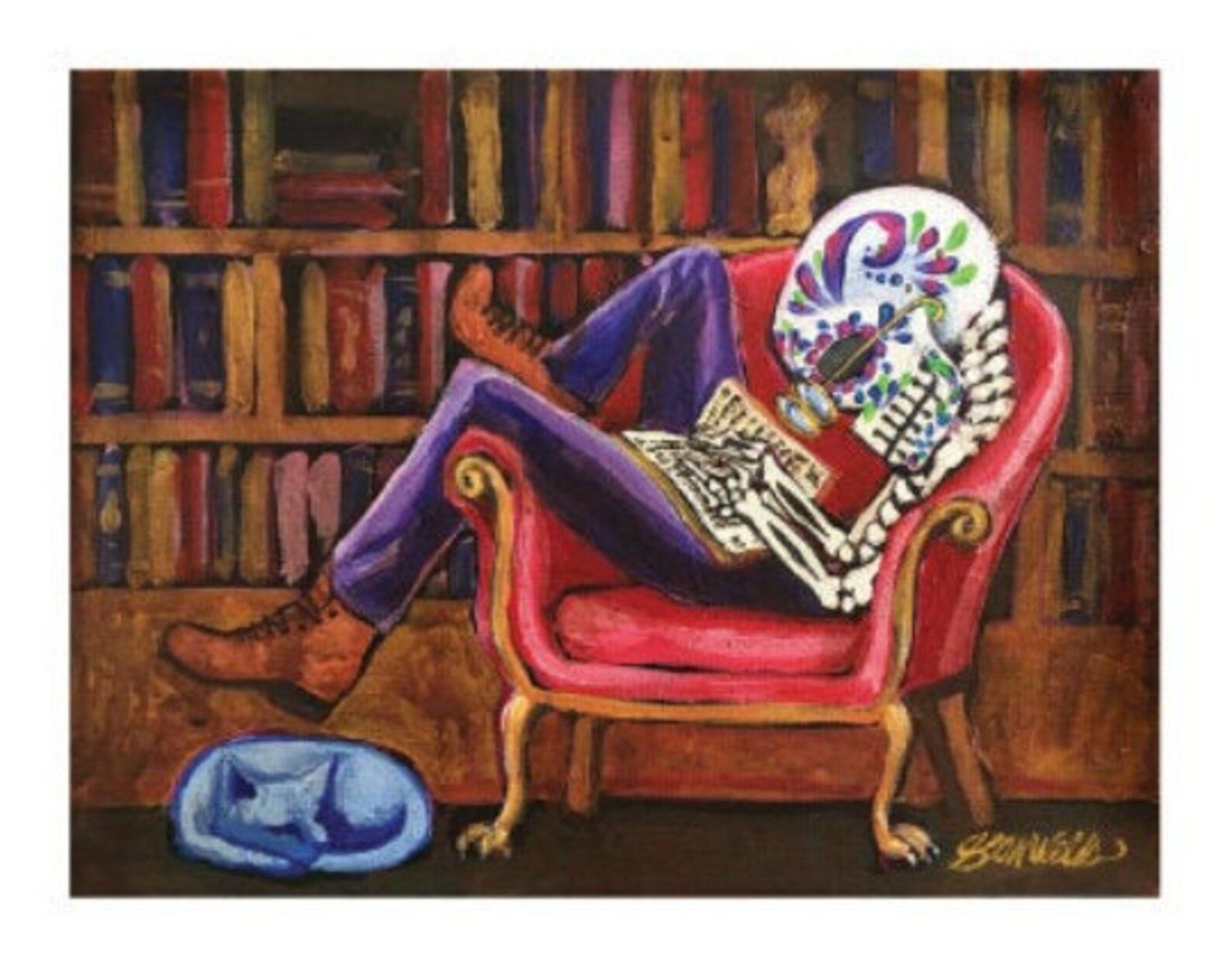 Image of a skeleton with a traditional sugar skull lounging in a red chair reading a book. There's a bookshelf behind the skeleton and a blue cat at the skeleton's feet. 