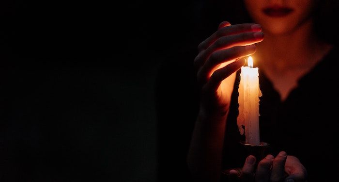 woman holding candle