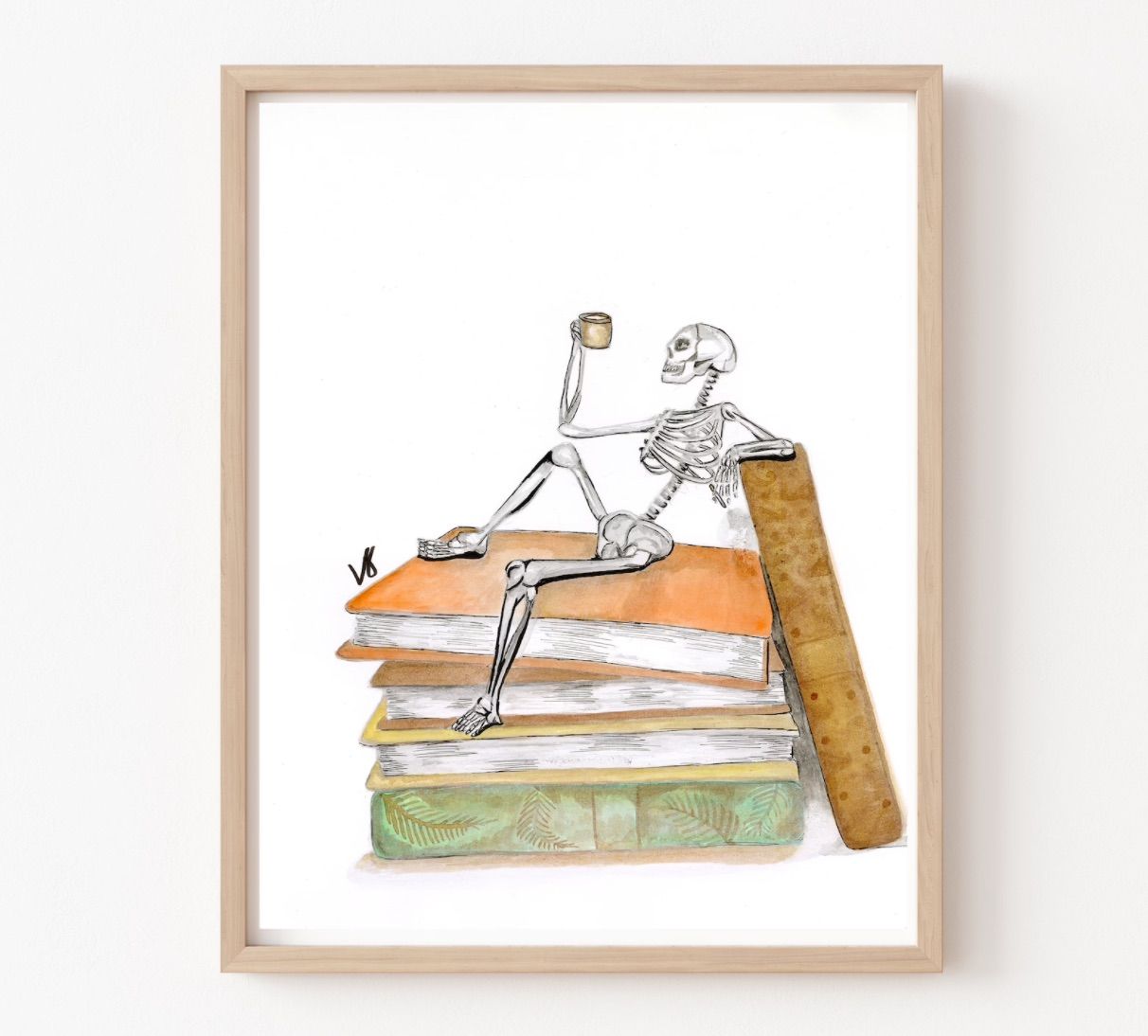 Image of a print featuring a skeleton with a cup of coffee on top of a stack of old books. 