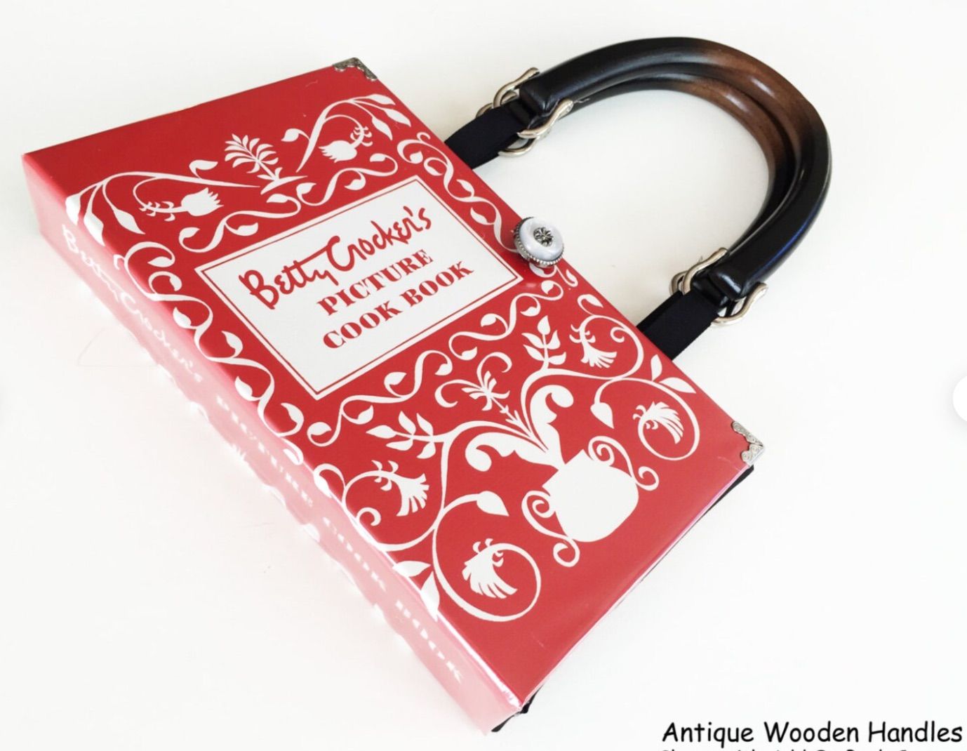 Image of red betty crocker picture cookbook made into a purse with antique wooden handles.