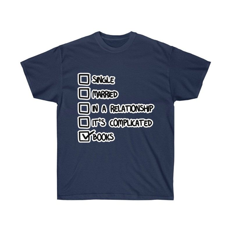 Image of a dark blue t-shirt with a list of check boxes on it, reading single, married, in a relationship, it's complicated, and books. Books has the box marked. 