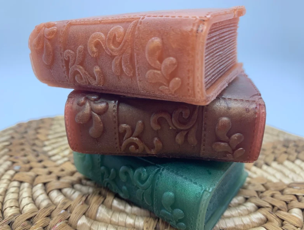 image of three soaps with the shape of an old leather book