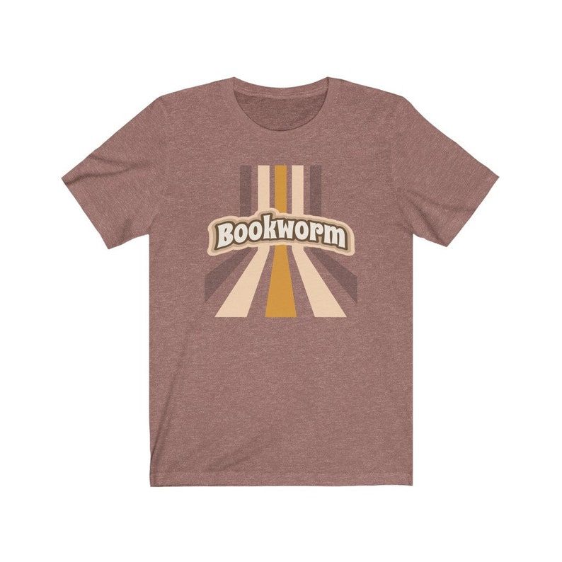 Image of a light brown shirt with the word "bookworm." 