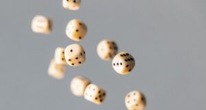 handful of dice falling through the air