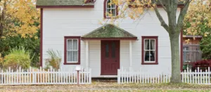 image of home and white picket fence by scott webb for unsplash