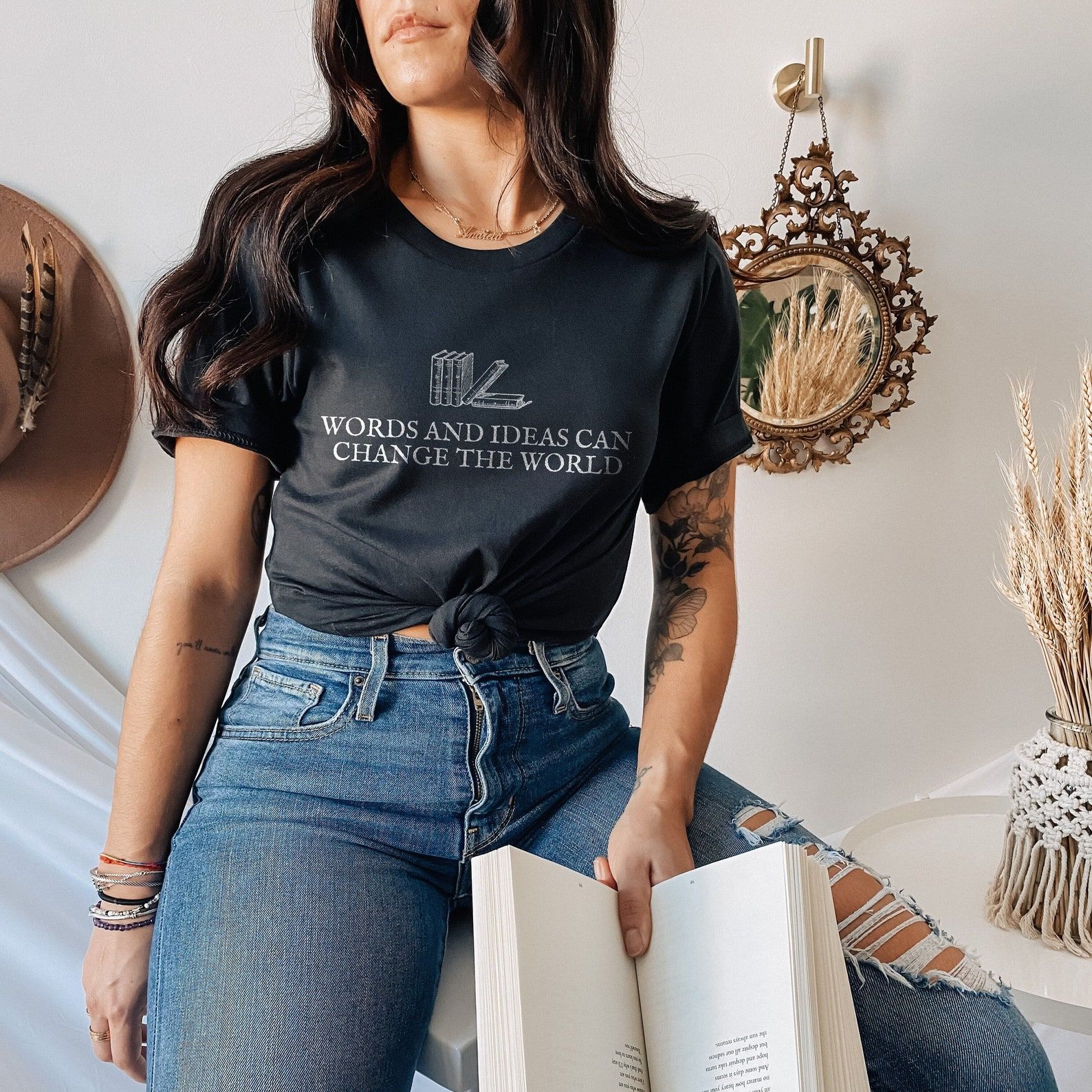 Image of a woman wearing a shirt that reads 