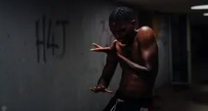 image of young Black man in creepy hallway