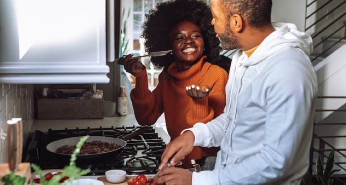 people smiling and cooking