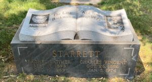 Grave of Charles Vincent Starrett, shaped like an open book, at Graceland Cemetery