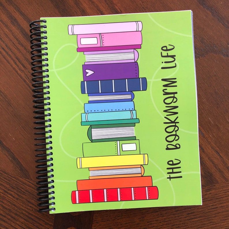The Bookworm Life Planner, showing an illustration of a rainbow stack of books
