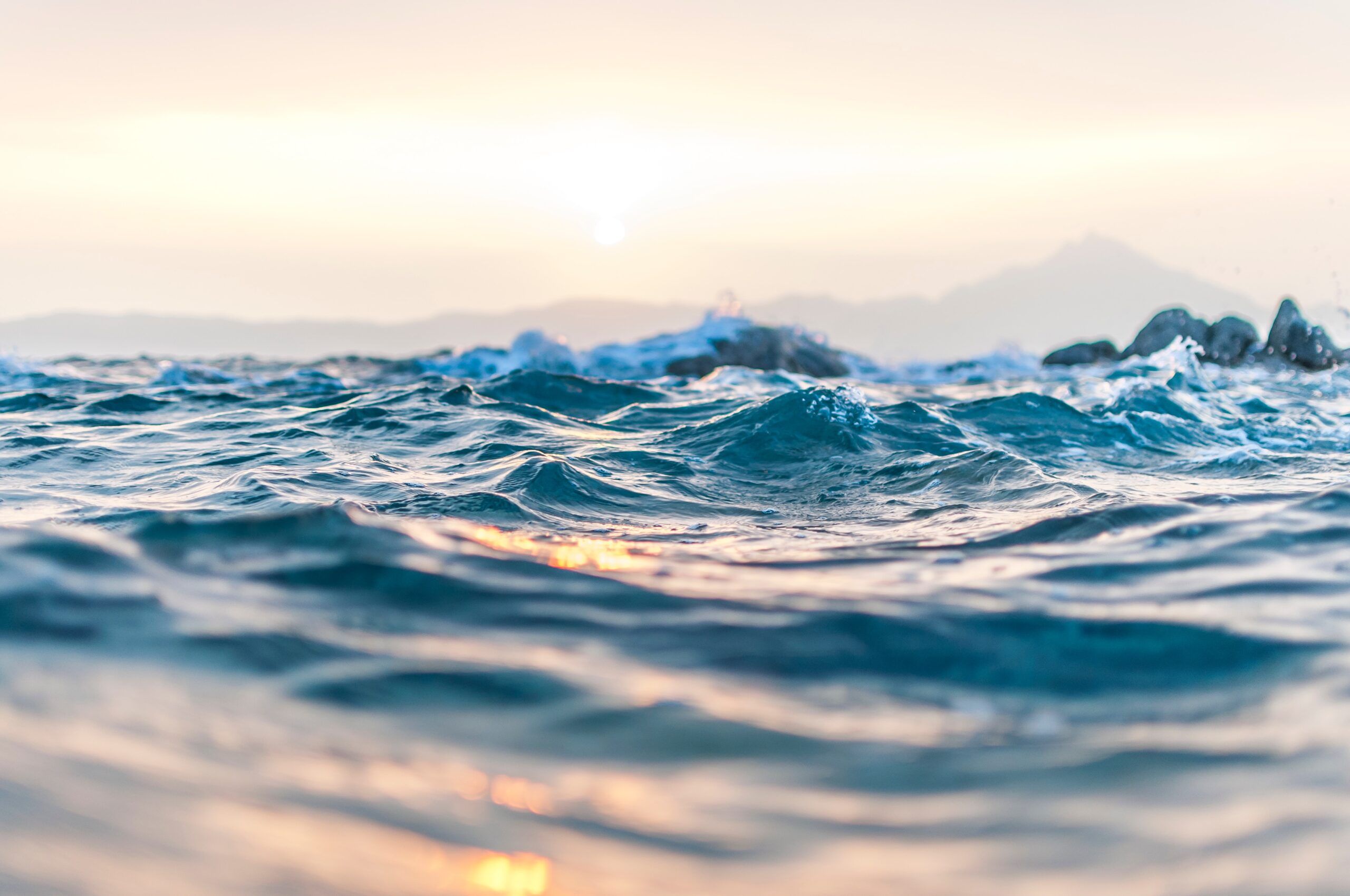 a photo of blue body of water with waves