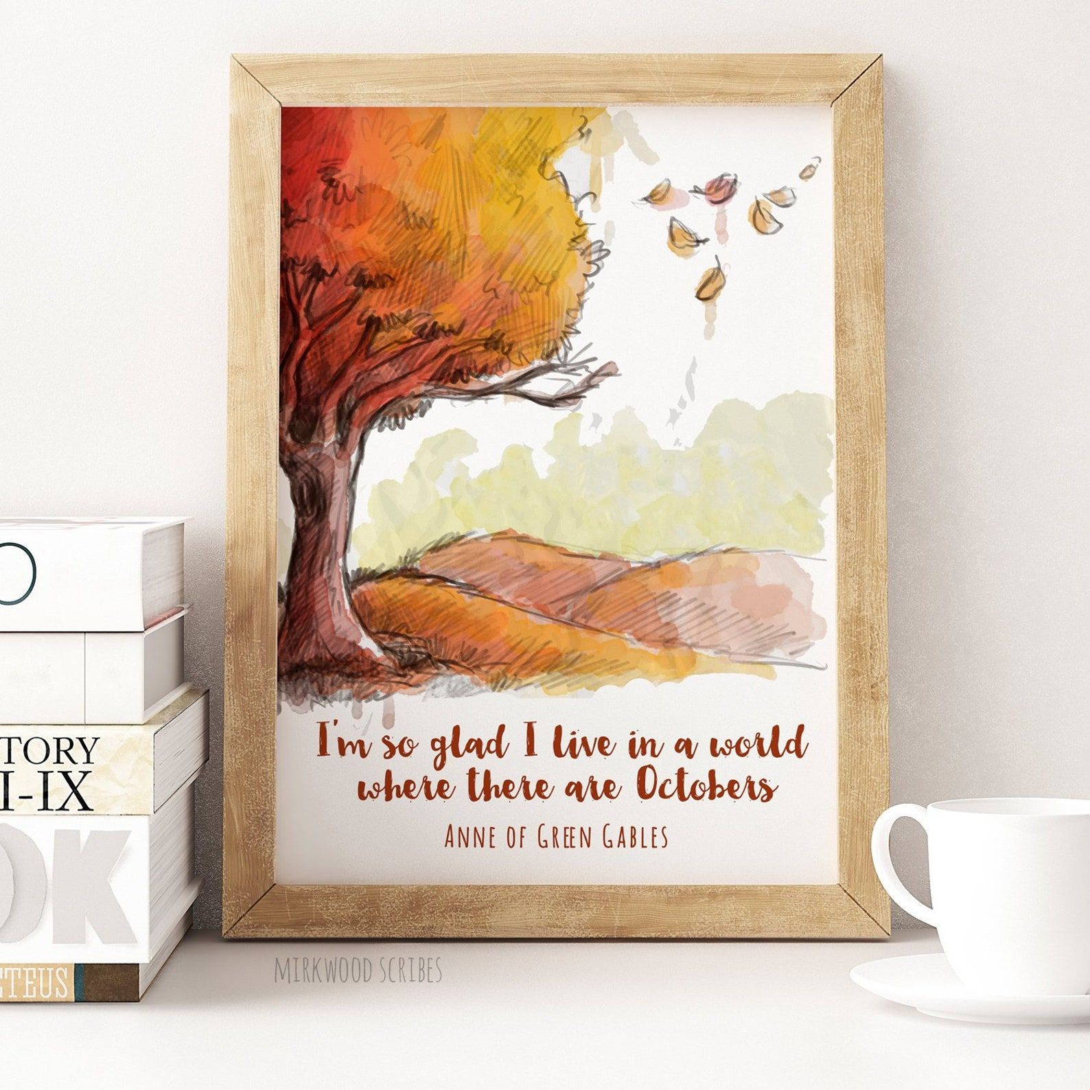 An art print depicting an orange and red autumn tree with falling leaves and the quote "I'm s glad I live in a world where there are Octobers."