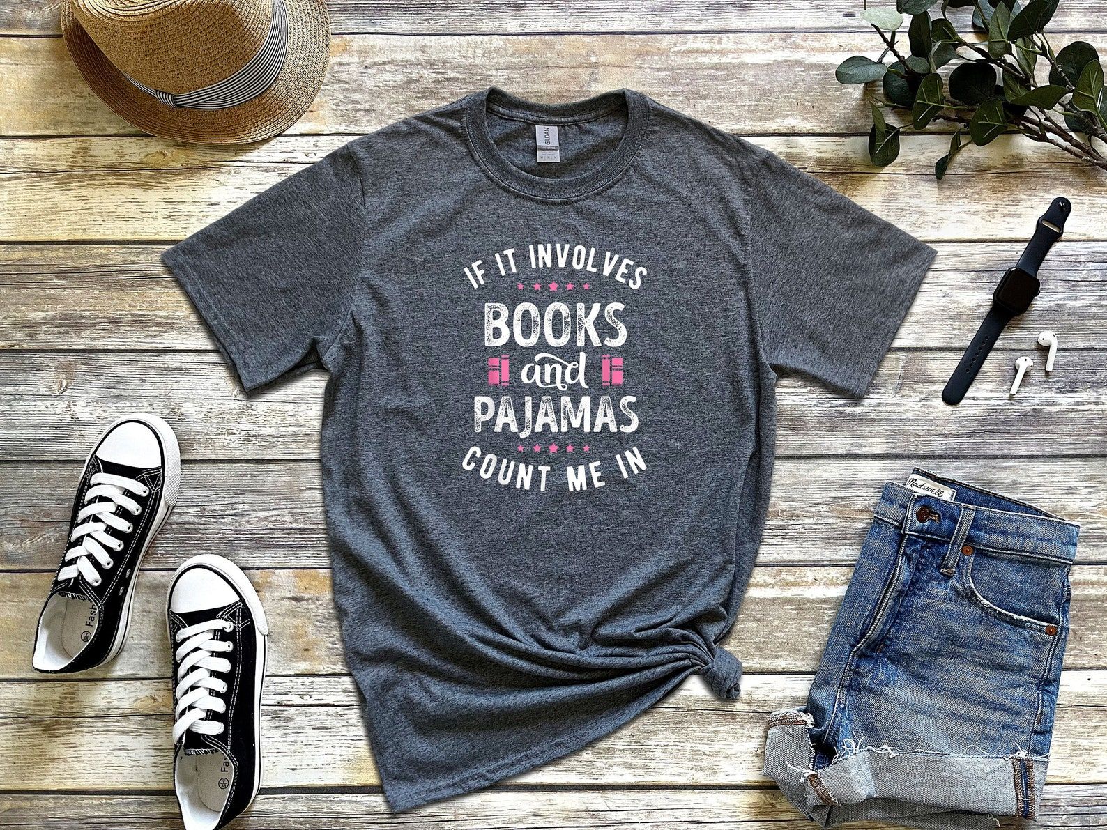 Gray t-shirt that reads If It involves books and pajamas, count me in"