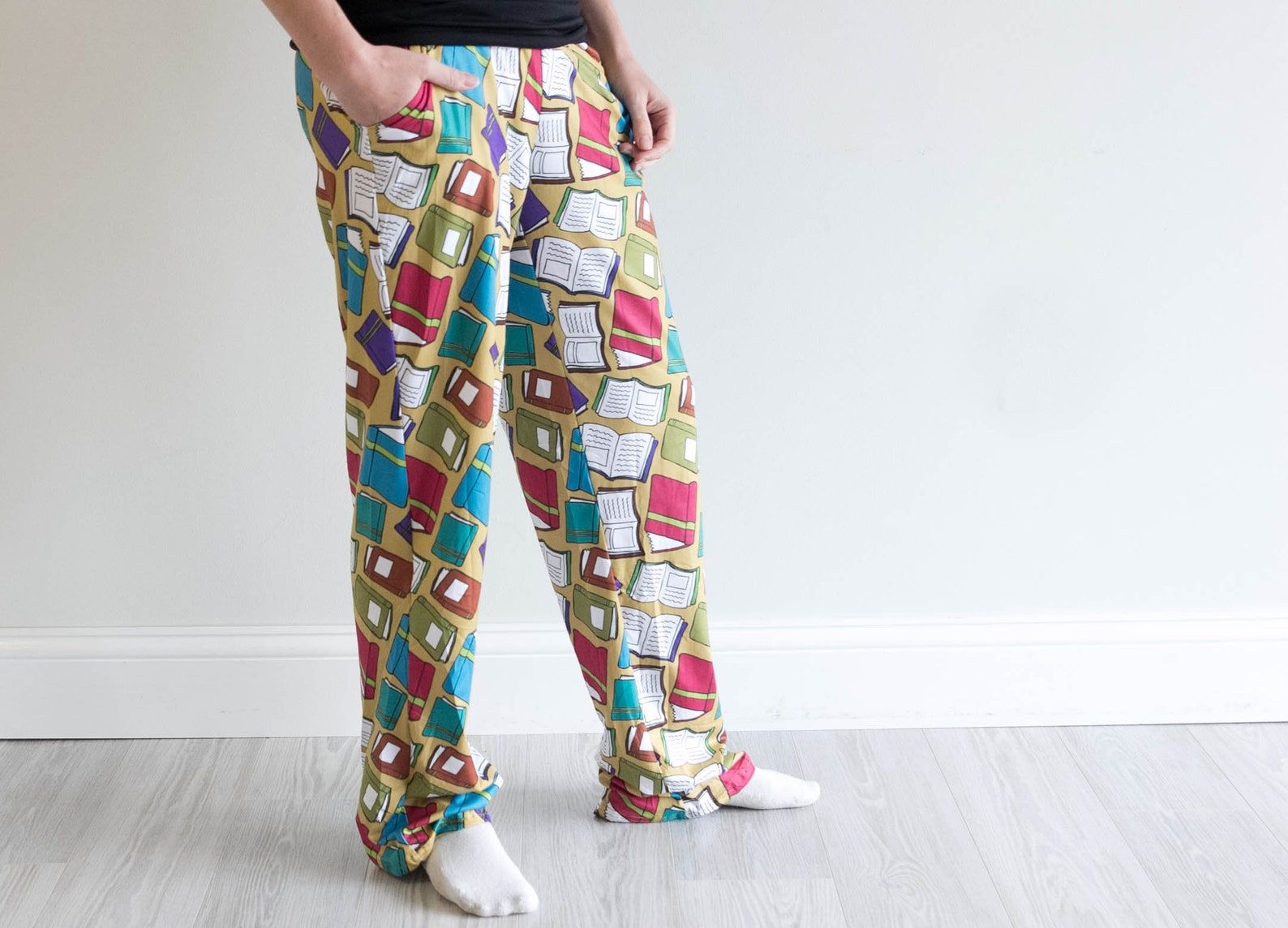 Yellow pajamas pants with a book motif