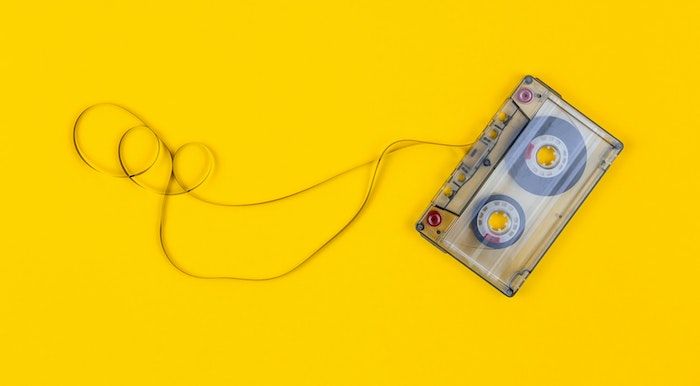Image of a cassette tape on yellow background