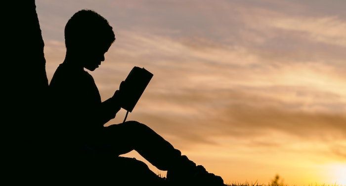 image of a child reading a book