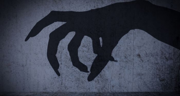 shadow of a creepy hand with claws