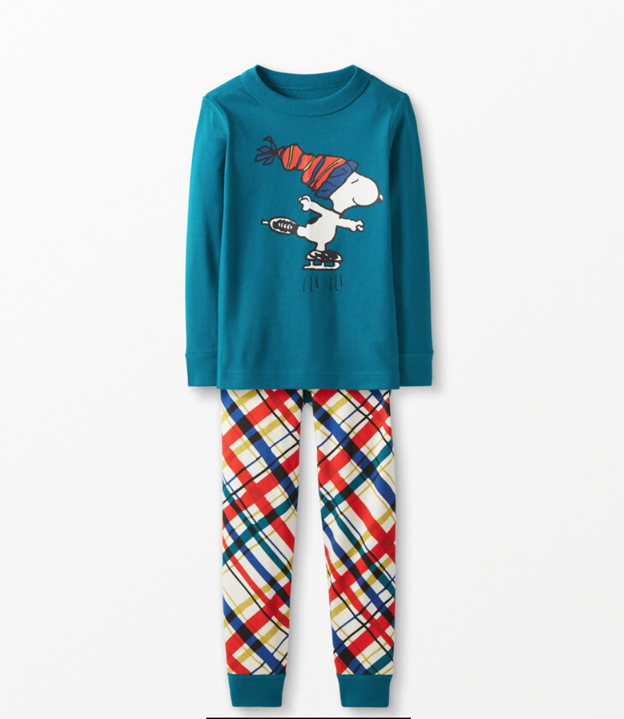 Blue long-sleeved PJ shirt depicting Snoopy ice skating, with matching red, blue, yellow, red, and white plaid PJ pants.