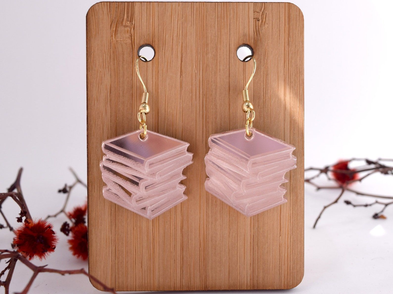 Image of a pair of rose gold book stack earrings.