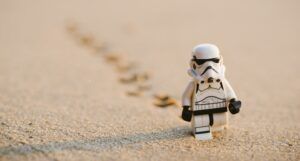 stormtrooper lego figure on sand