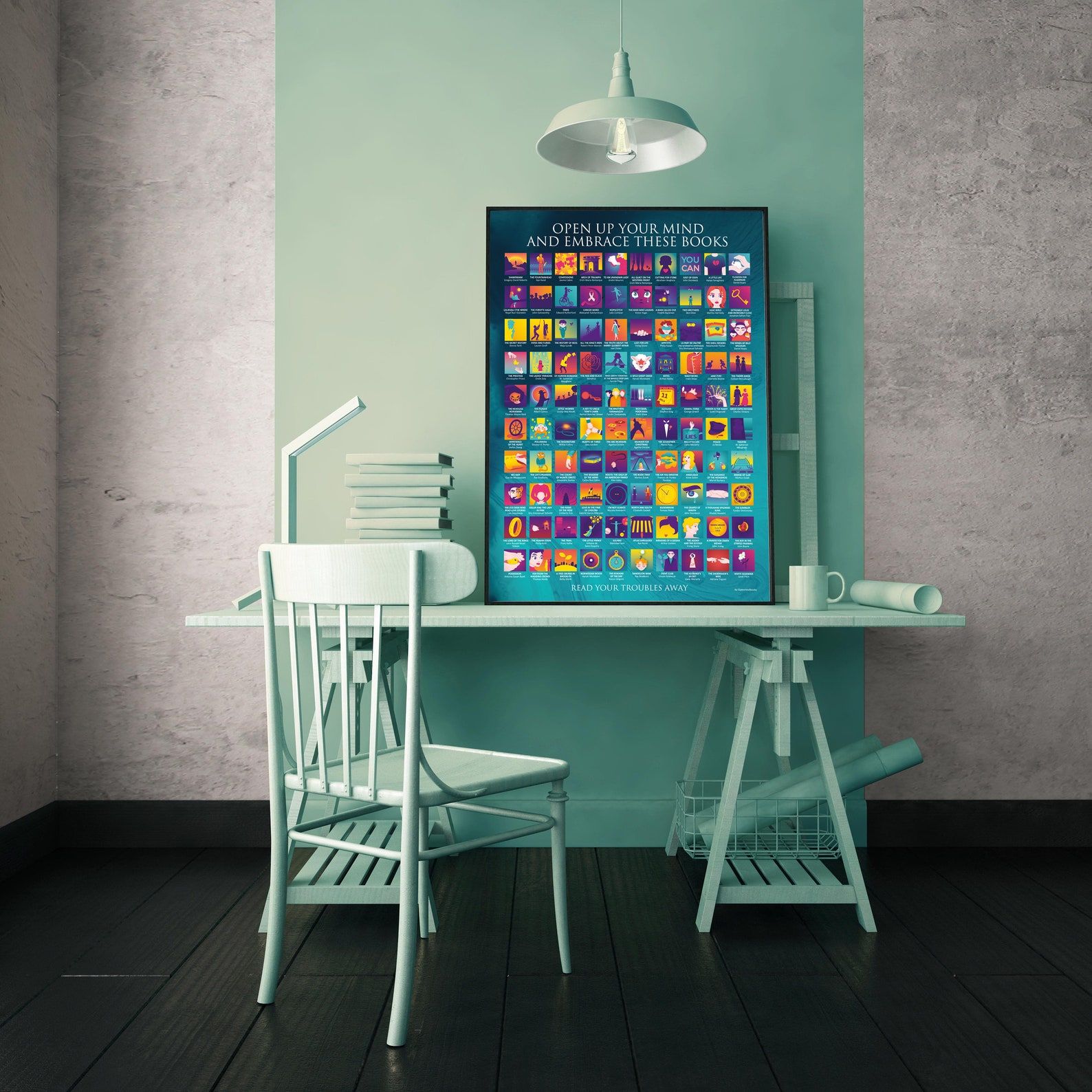 Image of a colorful poster on a green desk. The poster features 100 book covers. 