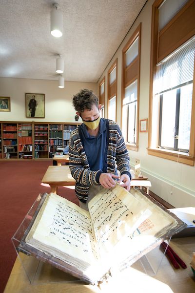 Person looking at enormous choir book