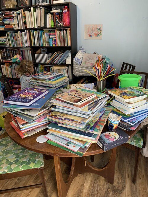 Table with stacks of children books