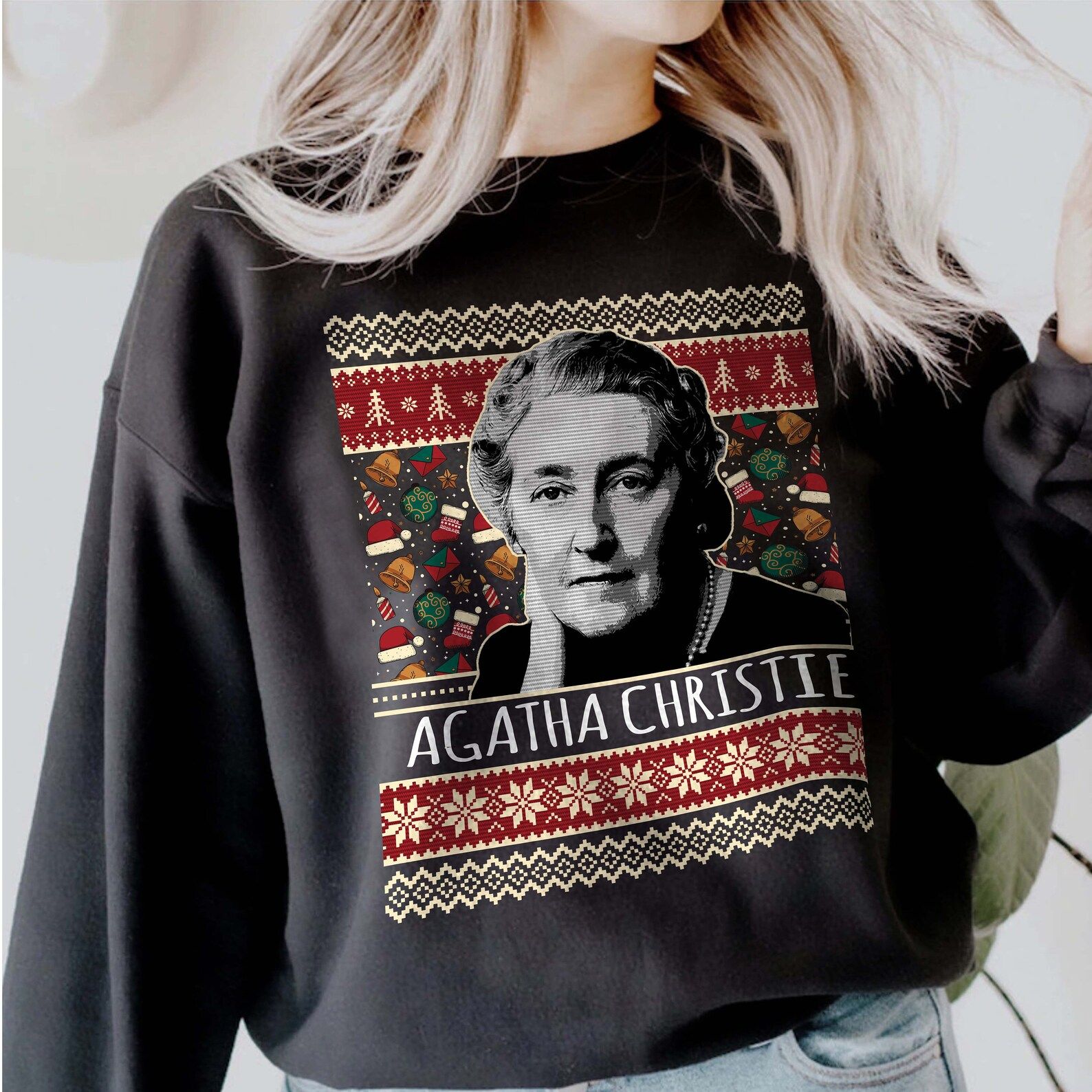 A gray sweatshirt with a holiday screen print pattern and Agatha Christie's face.